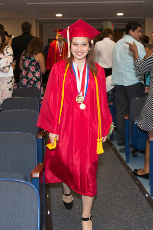 Cassandra Medina (Deaf) smiling as she walks down the aisle during the 104th Commencement for the Graduating Classes of 2018