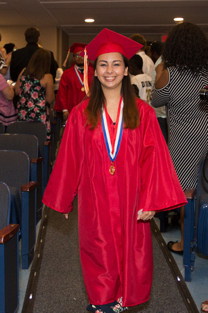 Francesca Cappielo (Deaf) smiling as she walks down the aisle during the 104th Commencement for the Graduating Classes of 2018