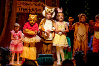 Piglet, Pooh, Owl, Rabbit, Kanga, and Tigger dancing on stage.