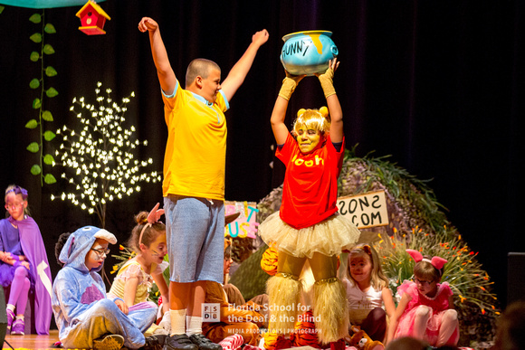 Christopher and Pooh celebrate getting a bowl of honey.