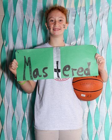 Girl holding basketball, word is Mastered
