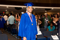 Kenneth Jimenez (Blind) smiling as he walks down the aisle during the 104th Commencement for the Graduating Classes of 2018