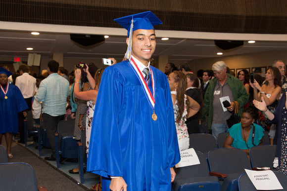 Kenneth Jimenez (Blind) smiling as he walks down the aisle during the 104th Commencement for the Graduating Classes of 2018