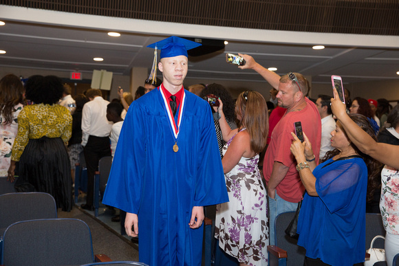 Rodney Cheathem (Blind) walks down the aisle during the 104th Commencement for the Graduating Classes of 2018