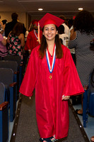 Francesca Cappielo (Deaf) smiling as she walks down the aisle during the 104th Commencement for the Graduating Classes of 2018