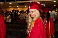 Sarah Traczyk smling as she walks to her seat during the 104th Commencement for the Graduating Classes of 2018