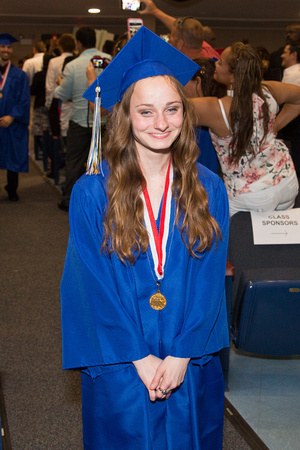 Taylor Muske (Blind) smiles as she walks down the aisle during the 104th Commencement for the Graduating Classes of 2018